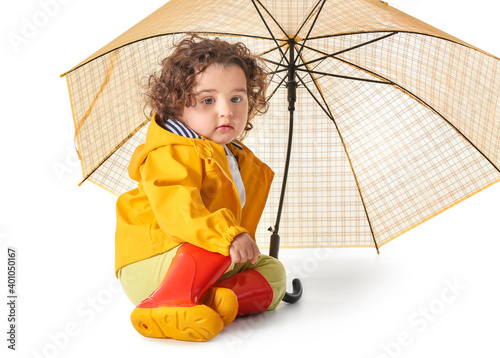 Cute baby girl in raincoat ...