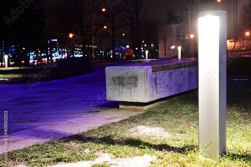 night photo in city of lights and bench outdoors photo