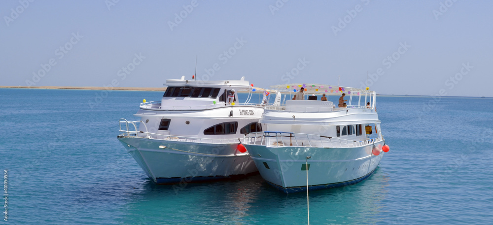 Egypt, Sinai, Sharm el-Sheikh, Red Sea, 27 September 2014: Two white pleasure boats in the Red Sea off the coast of Sharm el-Sheikh, Egypt