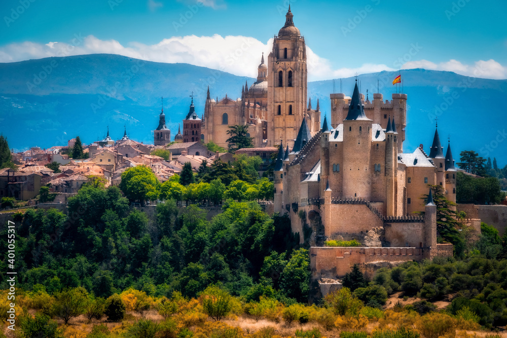 City of Segovia with a view of the Alcazar castle, cathedral and small houses around.
