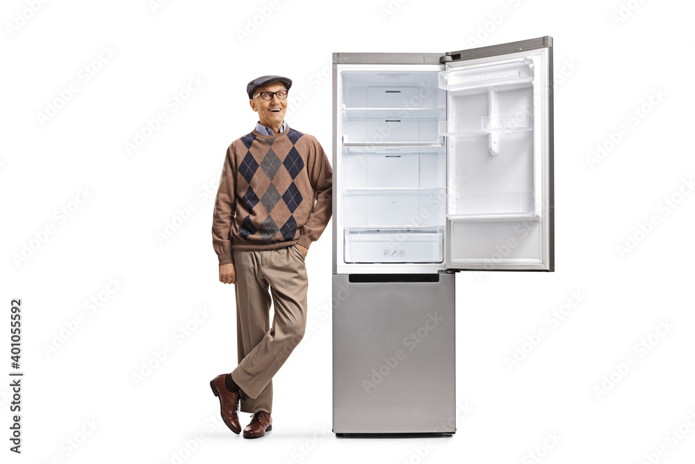 Full length portrait of a mature man smiling and leaning on a new refrigerator Full length portrait of a mature man smiling and leaning on a new refrigerator