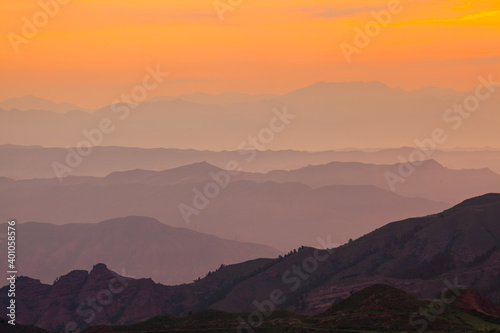 Sunrise over the mountains and hills in the northeast of the Qinghai province in China