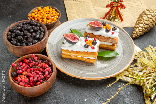 front view delicious waffle cakes with fruits on dark background sweet cake photo cream dessert