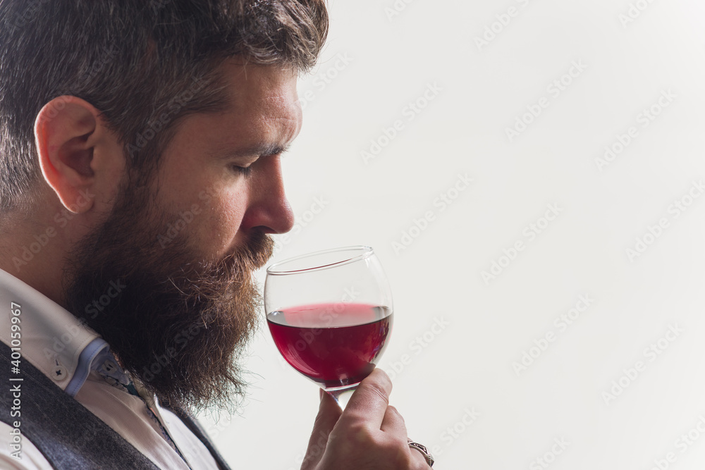 Wine. Wine degustation. Man with alcohol. Bearded man with glass of wine. Man drinks red wine. Man with Bordeaux. Wine. Wine degustation. Man with alcohol. Bearded man with glass of wine. Man drinks red wine. Man with Bordeaux.