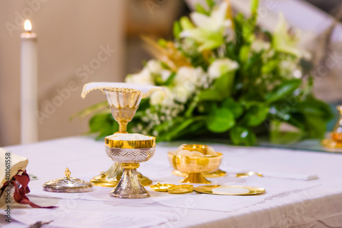 altar with host and chalice with wine in the churches of the pope of rome, francesco photo