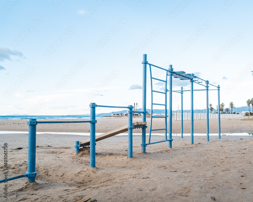 Calisthenics park on the beach. Outdoor gym for street workout and the view of the sea on the background.