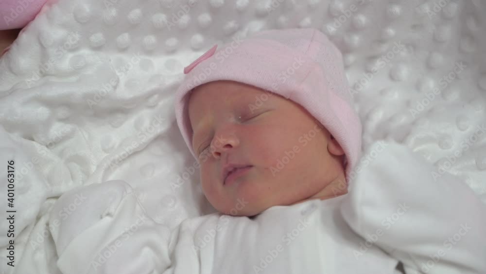 Sweet newborn baby girl sleeping in maternity hospital. Infant newborn baby face portrait. Maternity Healthy child concept. Parenthood. Motherhood. Beautiful Happy Family. Adoption, 4K Sweet newborn baby girl sleeping in maternity hospital. Infant newborn baby face portrait. Maternity Healthy child concept. Parenthood. Motherhood. Beautiful Happy Family. Adoption, 4K
