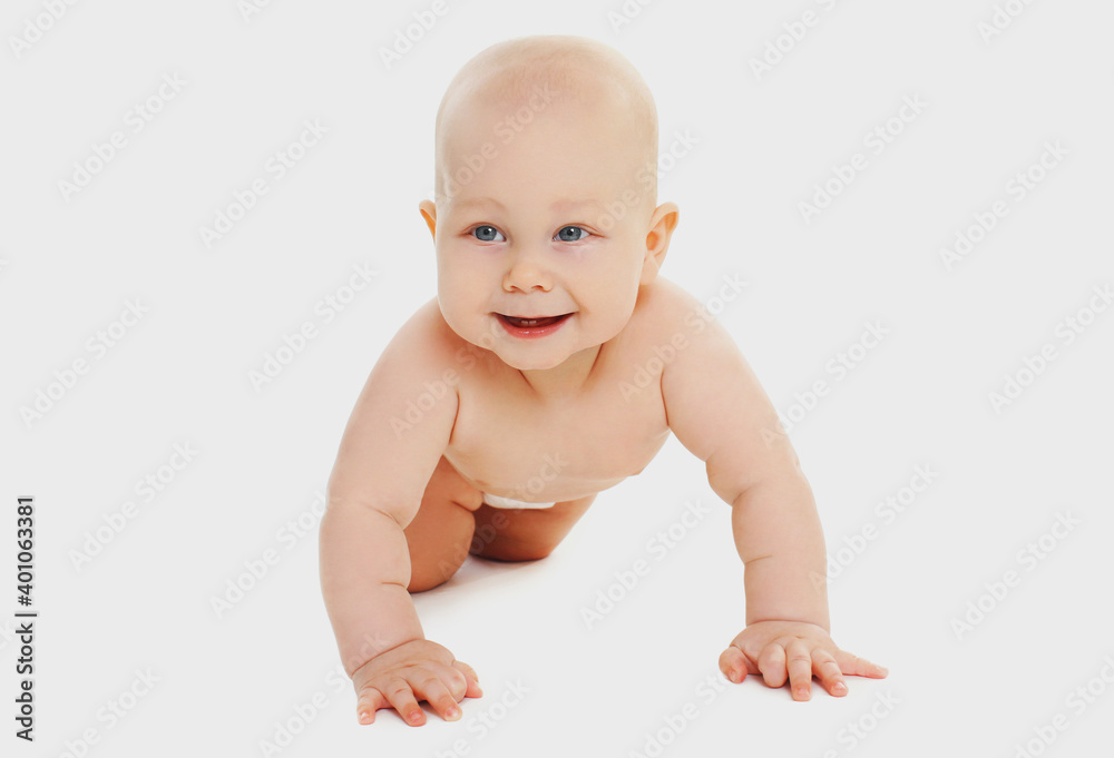 Portrait of cute baby crawling on the floor over a white background Portrait of cute baby crawling on the floor over a white background