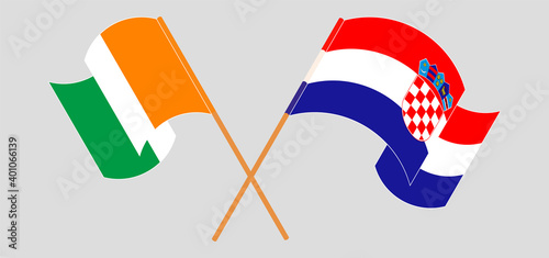 Crossed and waving flags of Republic of Ivory Coast and Croatia