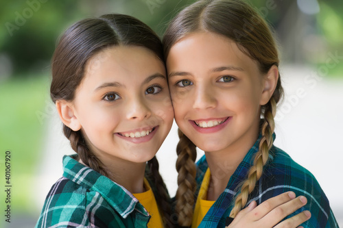 Valokuva Happy girls smile with cute look wearing long hair in plaits summer outdoors, be
