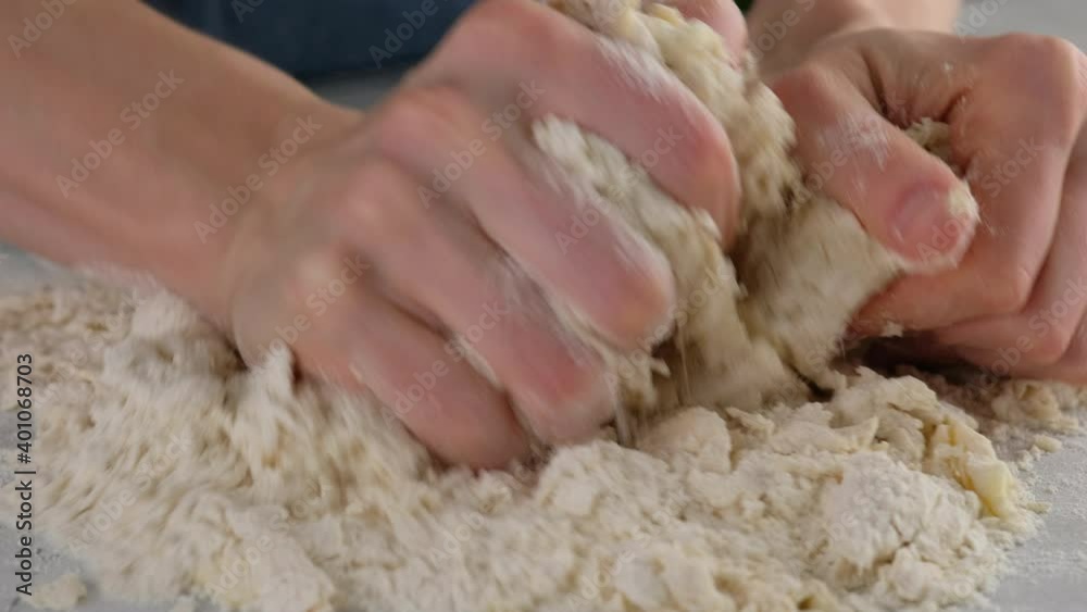 Beautiful female hands in a professional kitchen knead flour dough for making bread and buns. Yeast bread. Bread made from milk, butter, flour, eggs and yeast. eggs Beautiful female hands in a professional kitchen knead flour dough for making bread and buns. Yeast bread. Bread made from milk, butter, flour, eggs and yeast. eggs