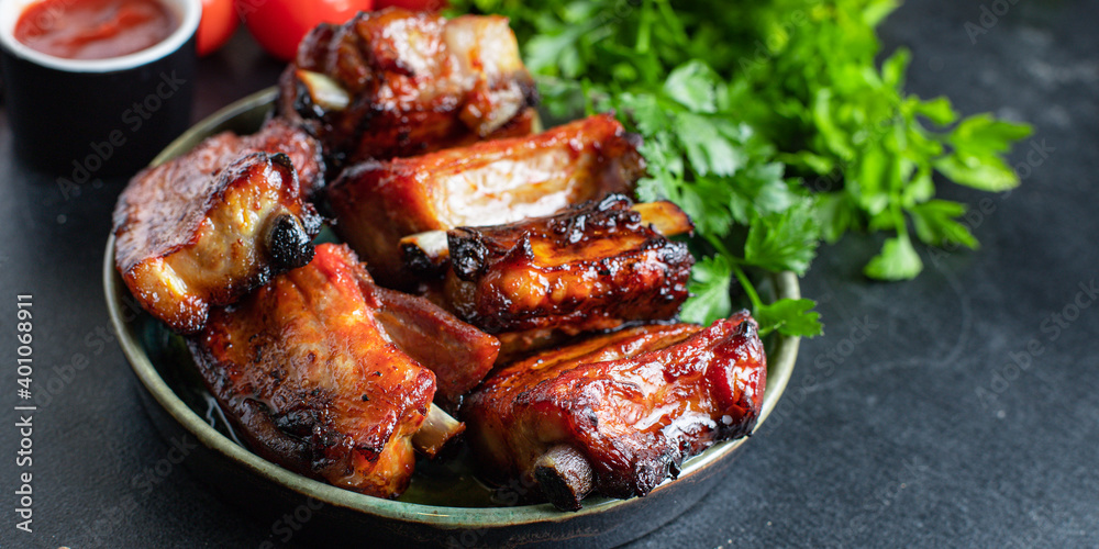 ribs meat pieces on the bone and lard fat grilled BBQ sauce second course snack ready to eat on the table meal top view copy space for text food background rustic image