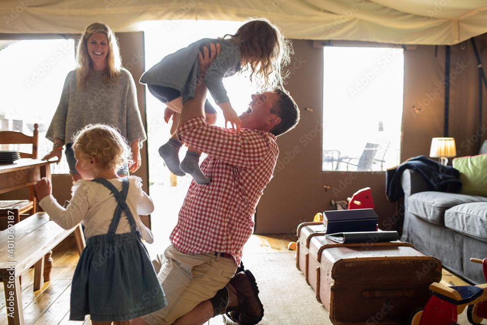 Happy family playing in cabin Stock Photo | Adobe Stock