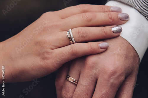 rings on hands of groom and bride