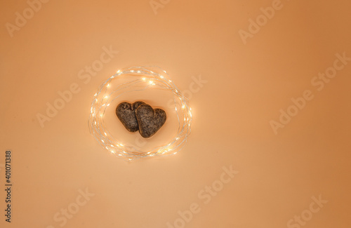 two gingerbread hearts in a circle of lights
