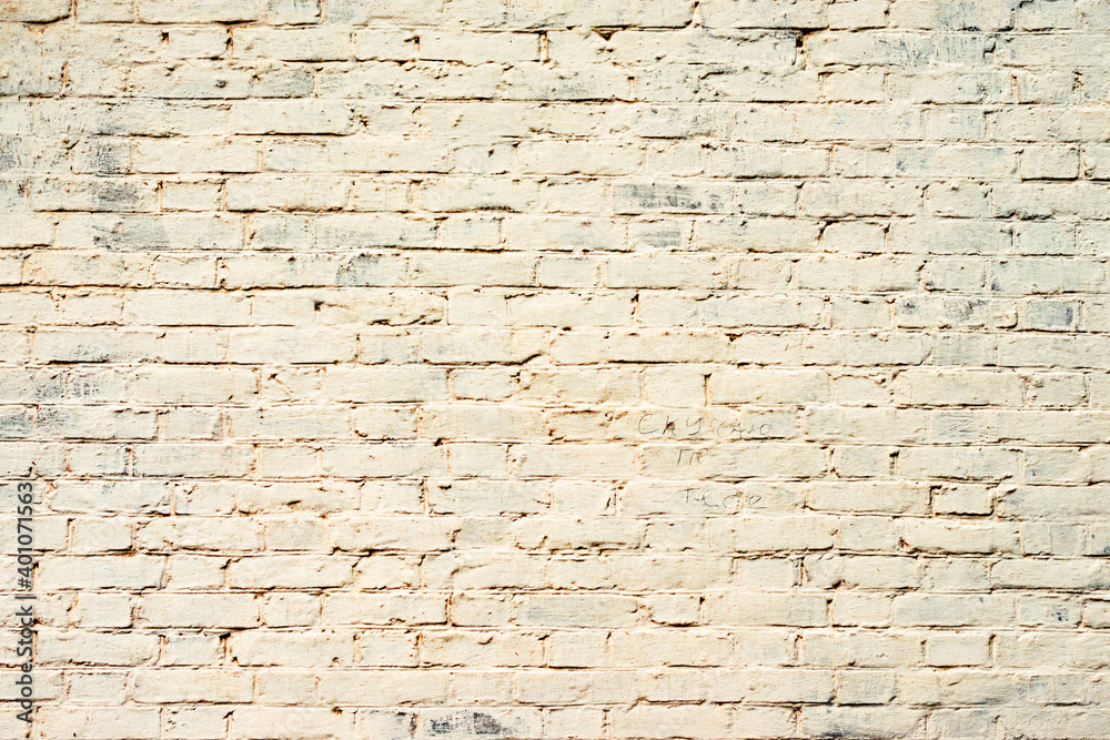 Obraz premium Texture of a brick wall with cracks and scratches which can be used as a background