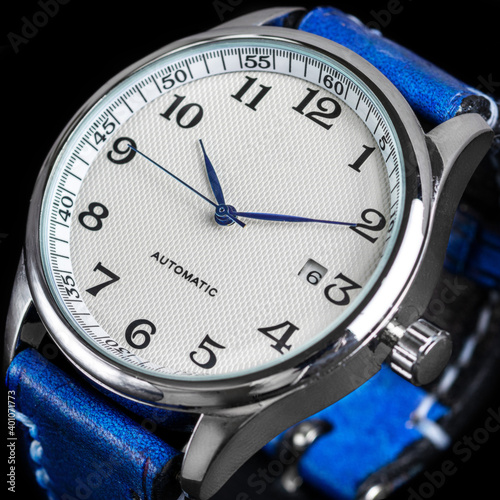 Mechanical automatic watch with blue dial hands and blue leather strap