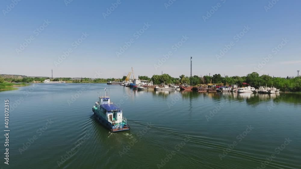 Flying above motor boat and beautiful river. Aerial view of amazing nature. Flying above motor boat and beautiful river. Aerial view of amazing nature.