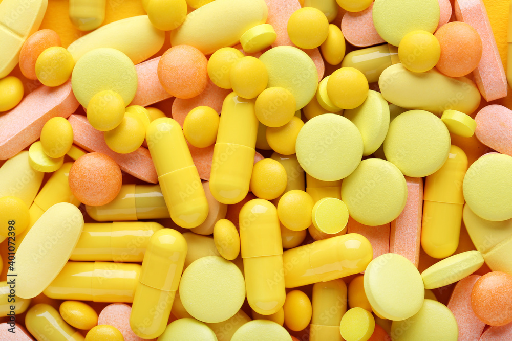 Background of yellow pills and capsules Background of yellow pills and capsules