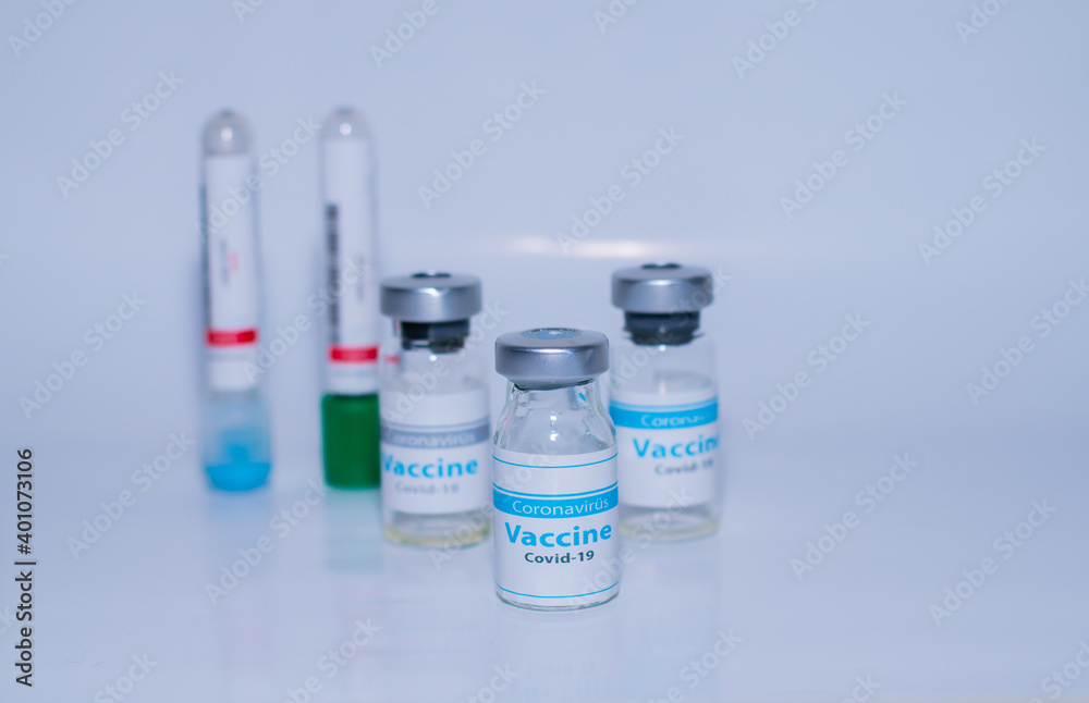 A single bottle vial of Covid-19 coronavirus vaccine in a research medical lab. A single bottle vial of Covid-19 coronavirus vaccine in a research medical lab.