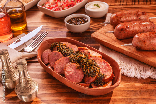 Brazilian pork sausage portion with chimichurri