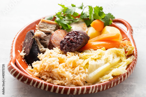 typical portuguese dish cozido a portuguesa on ceramic dish photo
