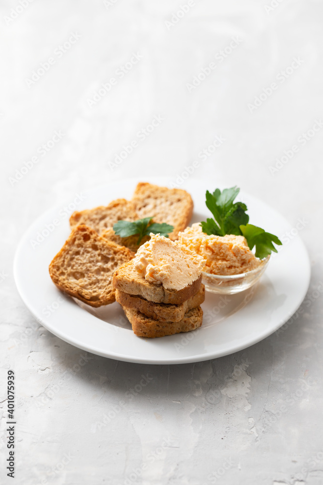toasts with fish pate on white plate toasts with fish pate on white plate