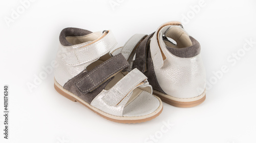 children's white and brown orthopedic sandals on a white background