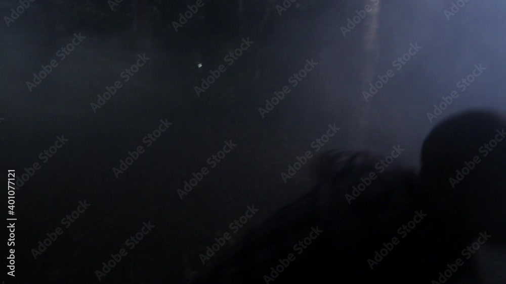 Frantic friends running in foggy woods at night
