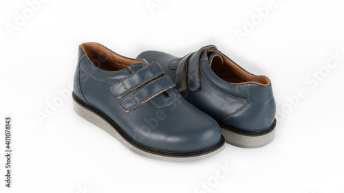 children's blue orthopedic shoes on a white background