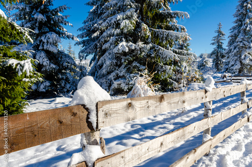 View to a winter landscape with wooden fence, near to Marisel village from Cluj county, Romania. photo