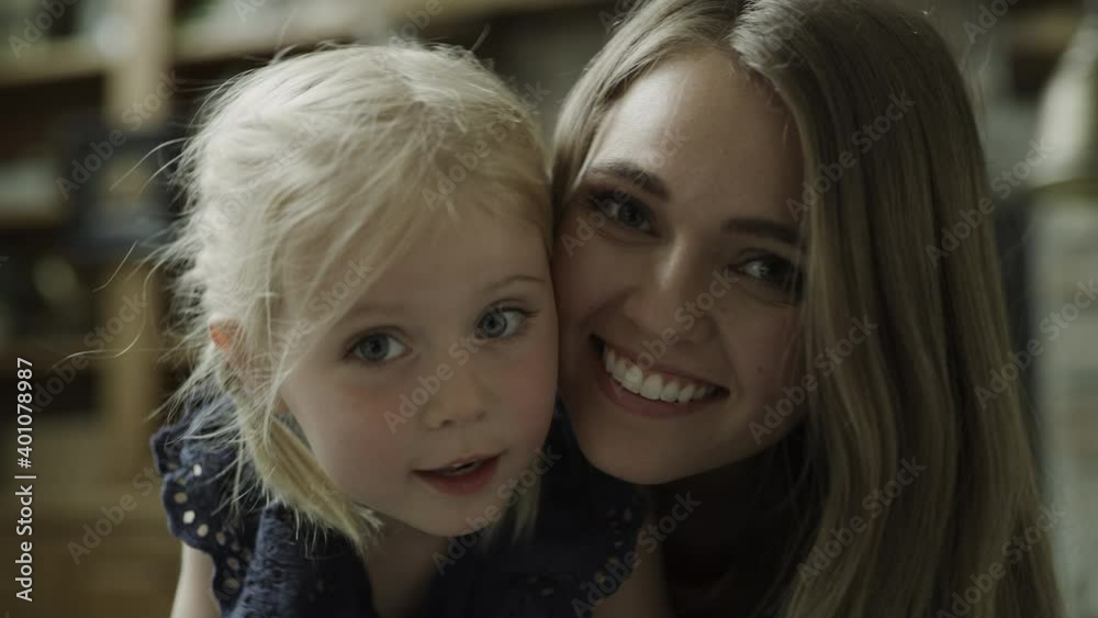 Close up portrait of smiling mother and daughter / Cedar Hills, Utah, United States Close up portrait of smiling mother and daughter / Cedar Hills, Utah, United States