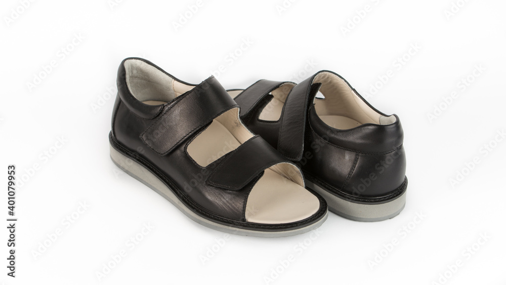 children's black orthopedic sandals on a white background children's black orthopedic sandals on a white background