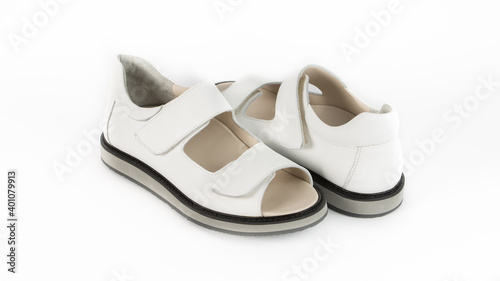 children's white orthopedic sandals on a white background