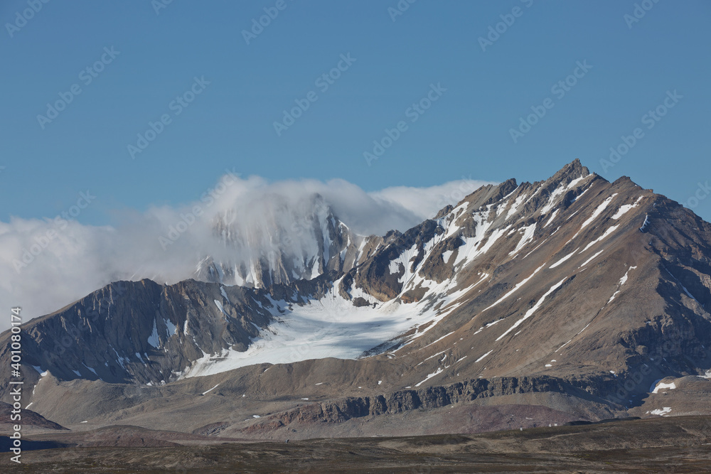 Fototapeta premium Mountains, glaciers and coastline landscape close to a village called 