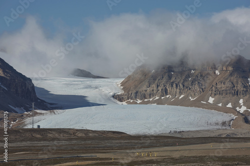 Mountains, glaciers and coastline landscape close to a village called 