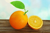 fresh orange citrus fruit with slices orange and leaves isolated in blur bokeh background