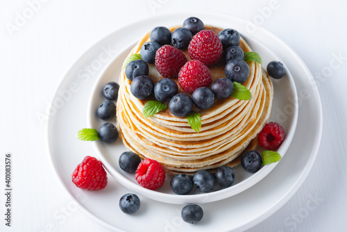 Traditional Russian pancakes with berries. Maslenitsa week. Pancake week.