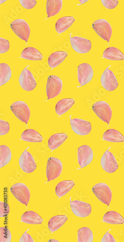 Pattern of fresh raw garlic clove isolated on yellow texture