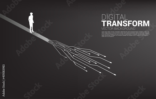 Silhouette of businessman standing on the way with dot connect line circuit. concept of digital transformation of business.