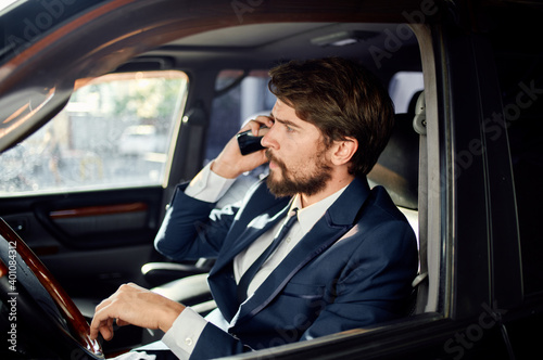 handsome man in suit driving a car trip official lifestyle © SHOTPRIME STUDIO