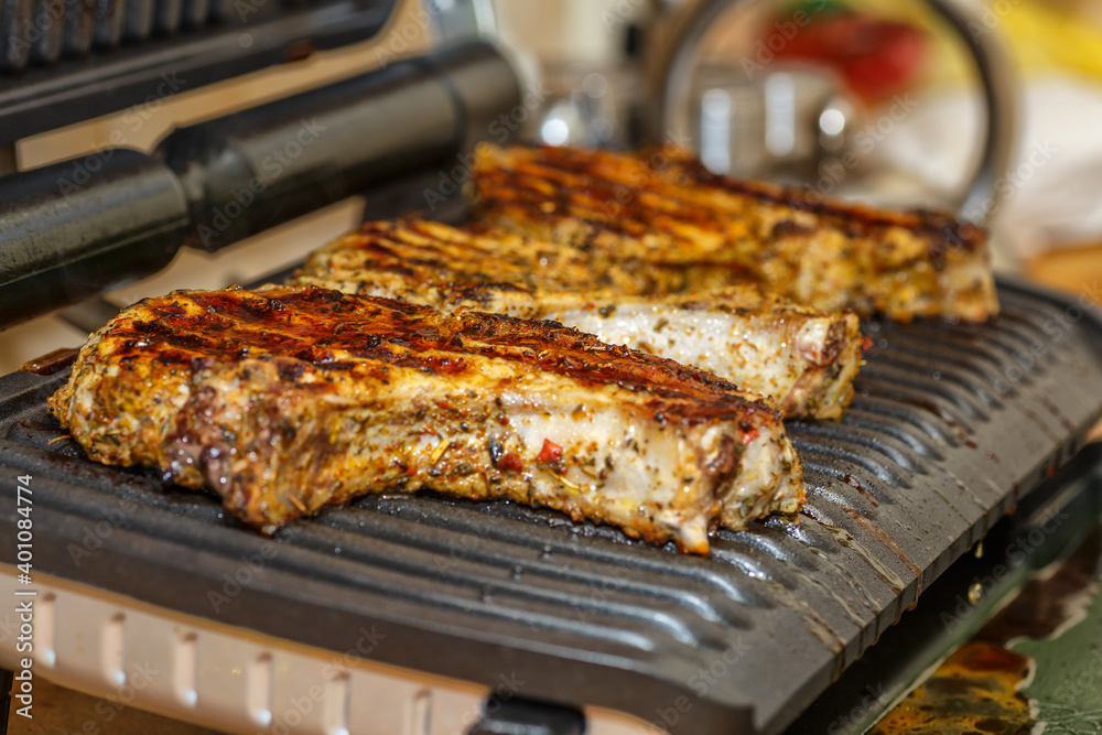 grilling steaks on a flaming grill grilling steaks on a flaming grill