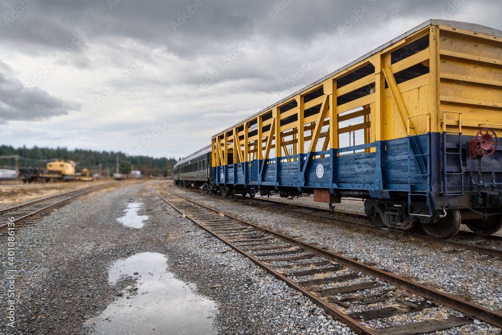 Fototapeta premium An empty train car sits on it's tracks at a railway station in Newport, Washington.