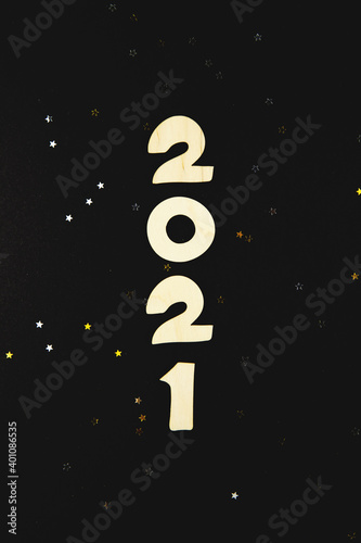 Wooden numbers 2021 on a black background.