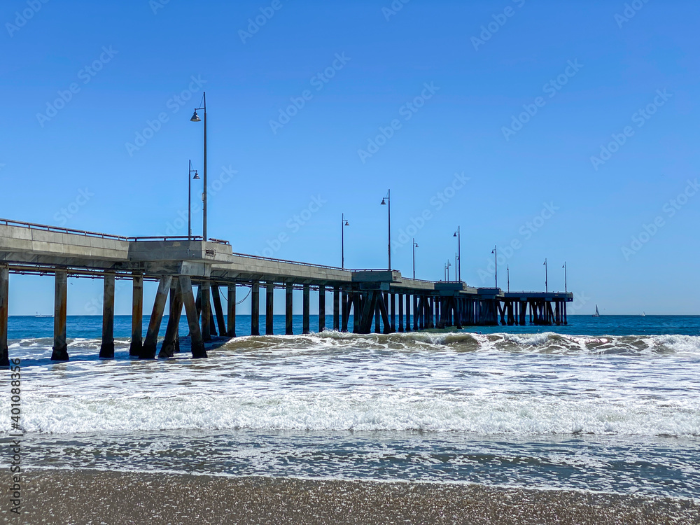 Long concrete pier on the ocean