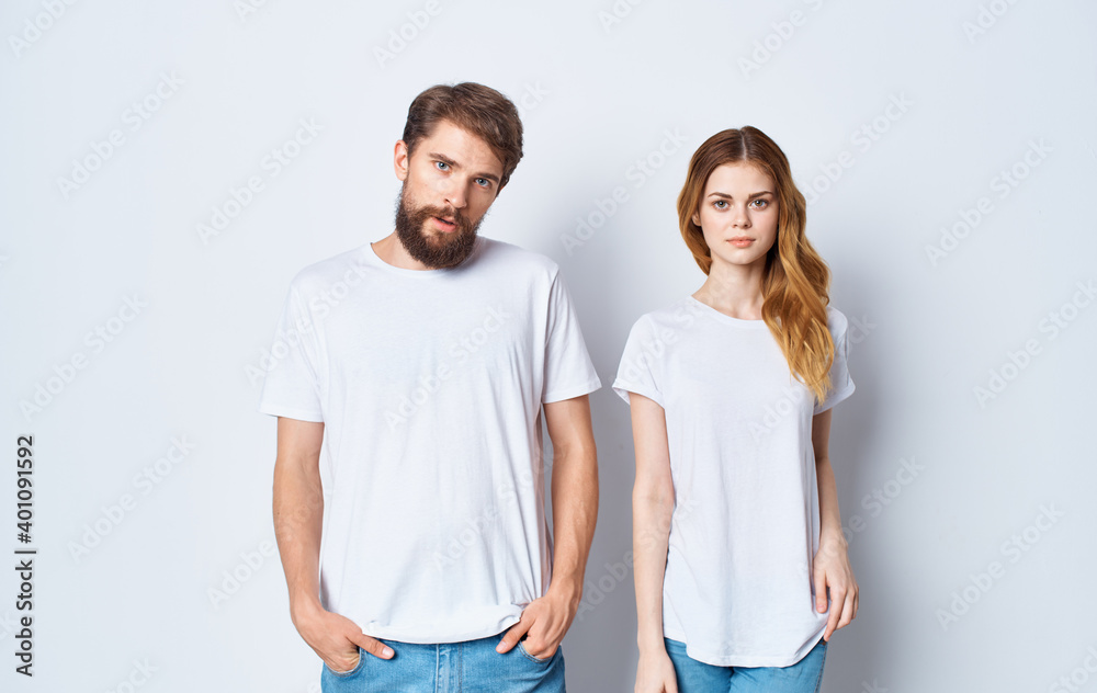 handsome guy explains something to a young woman on a light background cropped view family Copy Space handsome guy explains something to a young woman on a light background cropped view family Copy Space