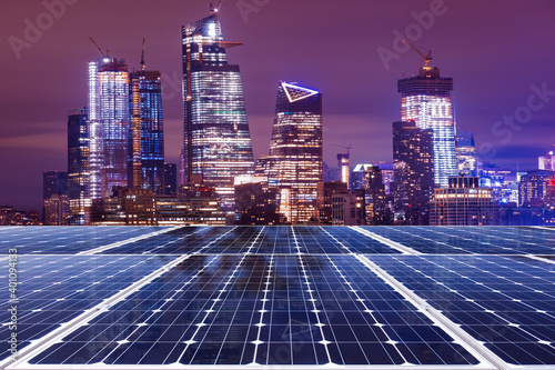 Solar panel over cityscapes, solar power green energy for life concept,New York City USA,