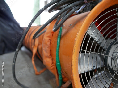 closeup of exhaust fan or portable ventilation fan at construction site.