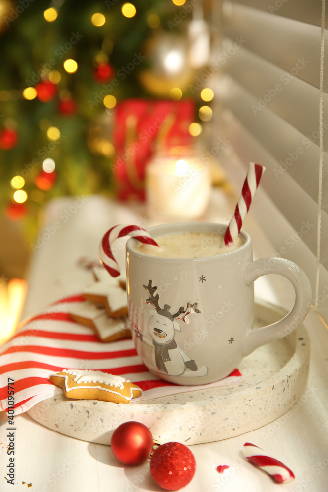 Fototapeta premium Composition with cup of hot drink on windowsill