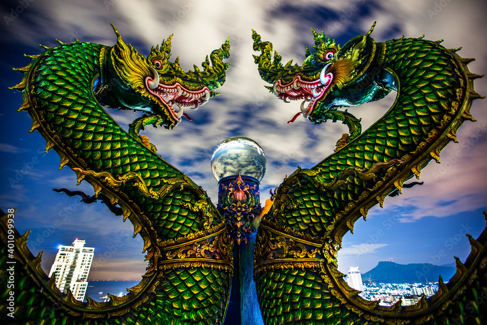 Fototapeta premium Wat Khao Phra Kru,Landmark of sriracha city with two of great Nagas guarded entrance to the view point and the crystal ball that gives an inverted view of the Sriracha scenery,Chonburi,Thailand